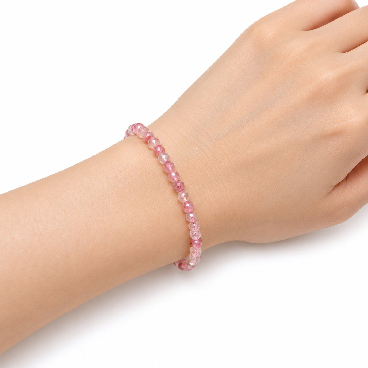 Strawberry Quartz Fine Bead Bracelet — wrist angle