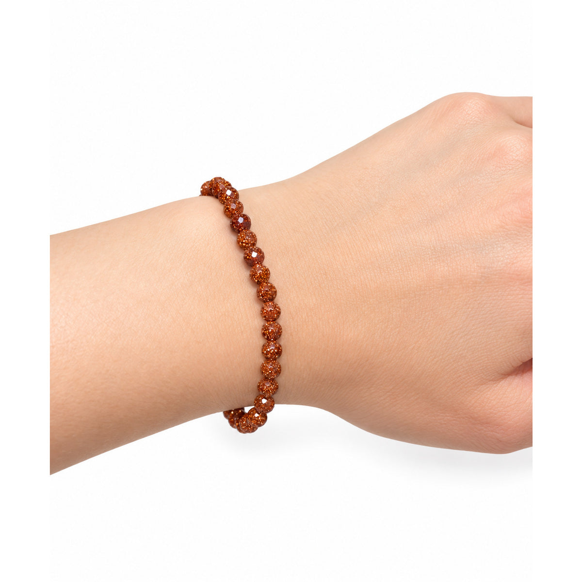 Red Goldstone Bead Bracelet — wrist side view