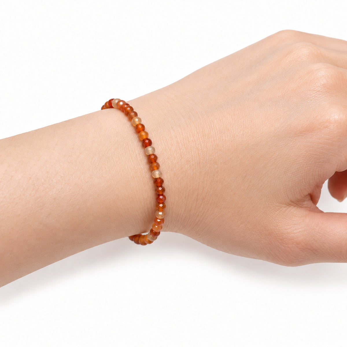 Carnelian Fine Bead Bracelet — wrist side view