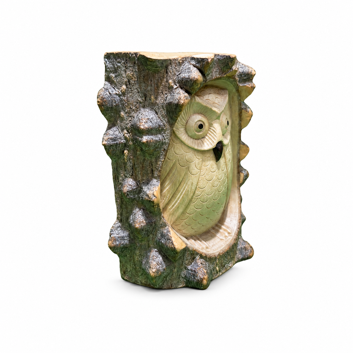 Carved owl in tree trunk, angled view
