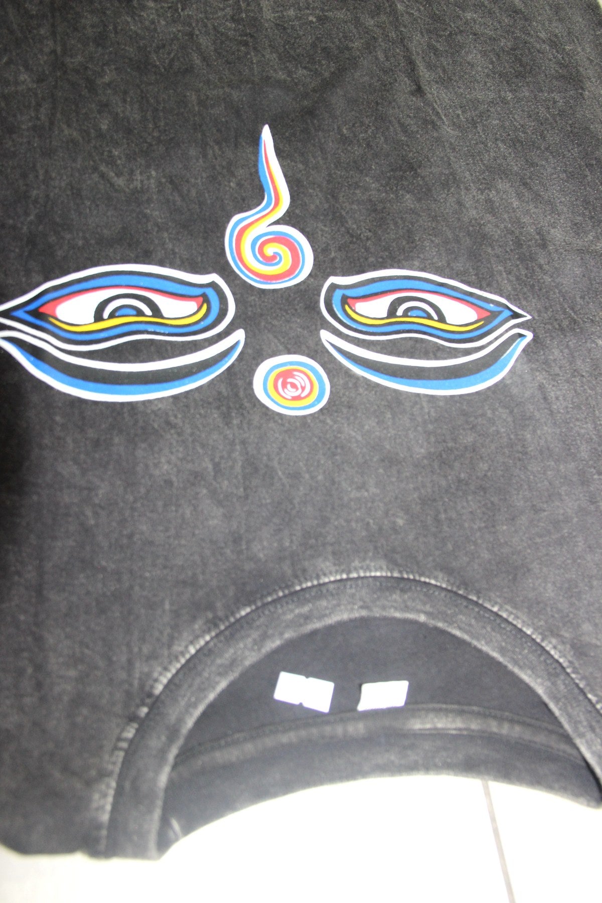 Wisdom Eyes in black color from Nepal — garment detail