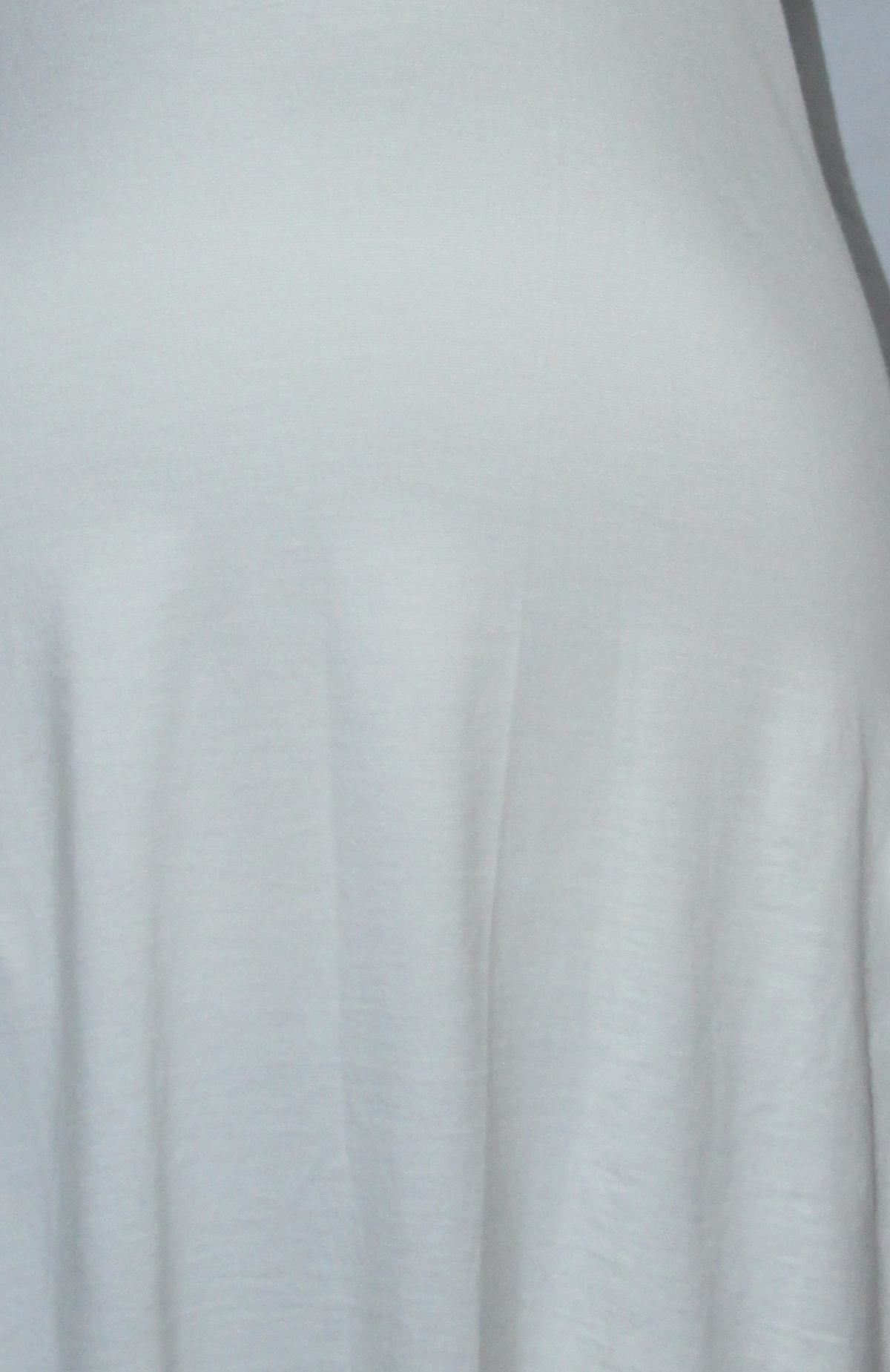 White Sleeveless Ladder-Back Dress — real fabric detail